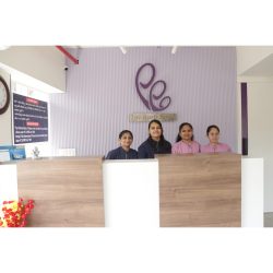 Friendly reception team at ayuh fertility centre – patient support desk Reception team at ayuh fertility centre welcoming patients with a smile